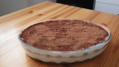 Tiramisu is on the table in the kitchen. Video stock 196871880