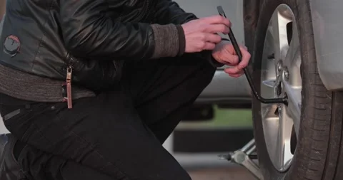 Tire change problems on the road Stock Footage 241815629