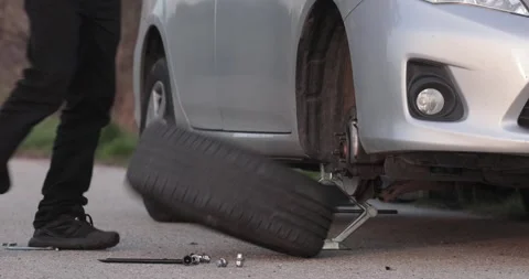 Tire change problems on the road Stock Footage 254528482