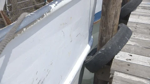 Tire cushion on pier Stock Footage 104880987