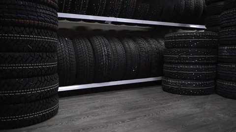The tire fell off the shelf to the floor. Slow motion. Stock Footage 82586375