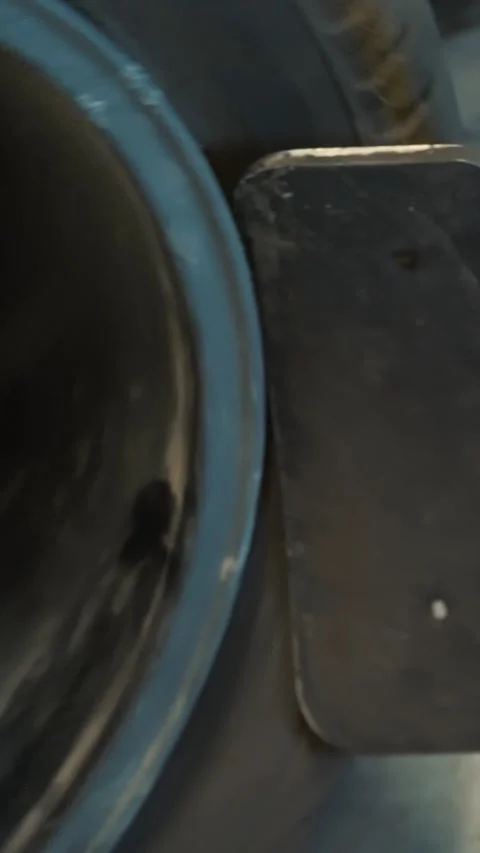Tire Fitting. Mechanic using hydraulic or mechanical press to remove used tire Stock Footage 314792465