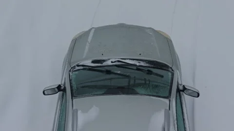 Tire marks in melting snow. Fresh tire impressions carve through moist powdered Stock Footage 329071883