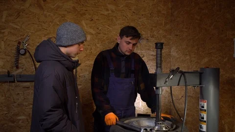 The tire master talks to the client Stock Footage 126527769