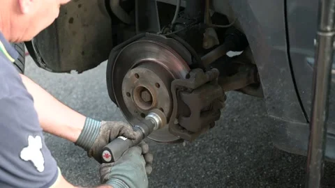 Tire repairer at mechanical work Stock Footage 137252366