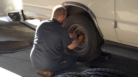 Tire replacement using a powertool Stock Footage 91948862