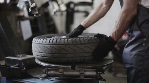 Tire service: Removing the tire from the disk Stock Footage 53465701