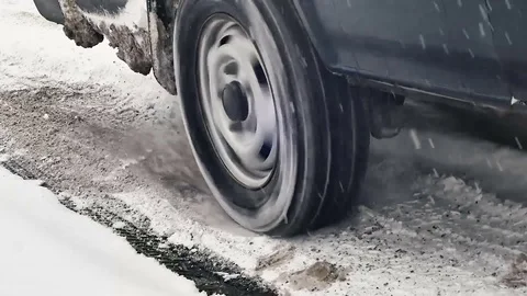 Tire slipping snow Stock Footage 84786846