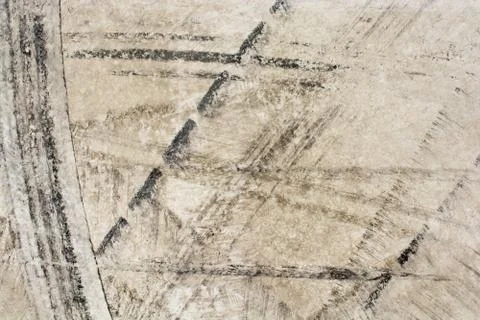 Tire trace patterns of fresh concrete surface in view Stock Photos