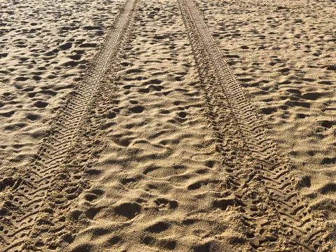 Tire tracks in beach road Stock Photos