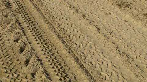 Tire tracks in sand Stock Footage 8974563