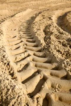 Tire tracks in the sand - surface level Stock Photos