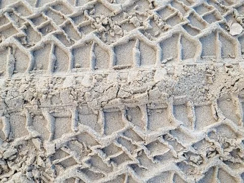 Tire Tread Pattern On Sand Stock Photos