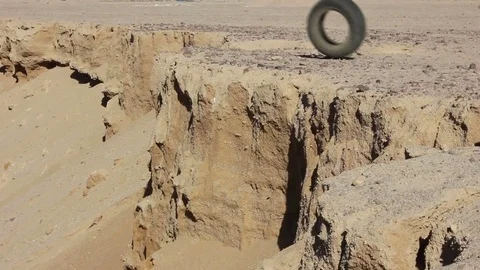The tire from the wheel flies into the pit Stock Footage 82453387