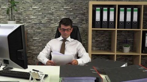Tired accountant does not readily sort documents Stock Footage 115571754