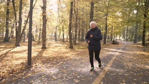 Tired of active cardio training aged female runner Stock Footage 168186696