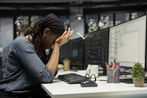 Tired admin in AI startup office having strained eyesight from overworking 스톡 사진