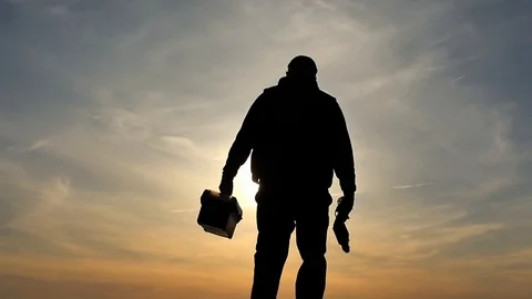 Tired after work man with tool box and drill slow motion silhouette Stock Footage 88844441