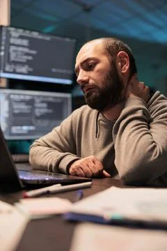 Tired app developer dealing with back pain Foto stock