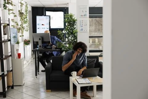 Tired arab employee solving complex business task on laptop Stock Photos