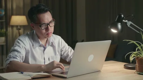 Tired Asia Man While Working From Home At Living Room At Night Stock Footage 154917576