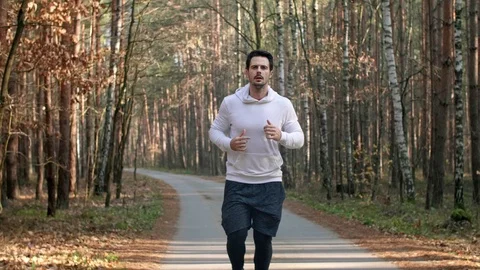 Tired athlete using a mobile phone Stock Footage 102824359