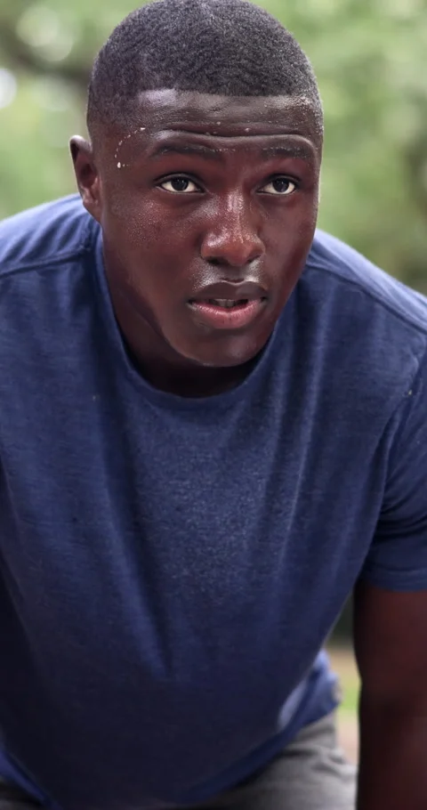 Tired, black man and sweat at park for fitness, exercise and exhausted from Stock Footage 340752010