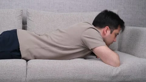 Tired bored man lying Stock Footage 269837810