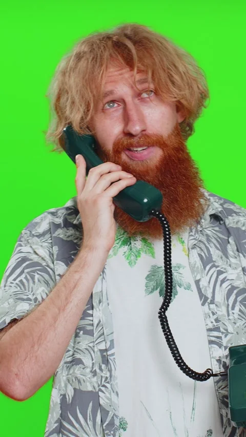 Tired bored man talking on wired vintage telephone exhausted of talk, making Stock Footage 328195569