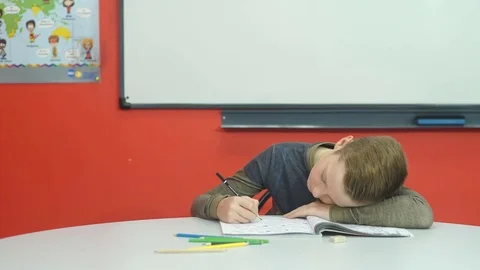 Tired boy doesn't want to do homework Stock Footage 70593894