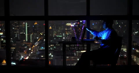Tired businessman reading e-mails late in the evening at the office Stock Footage 305120963