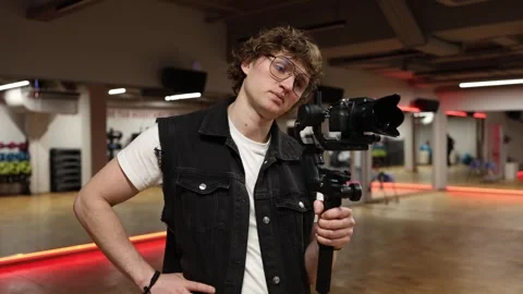 Tired cameraman during filming Stock Footage 332116830