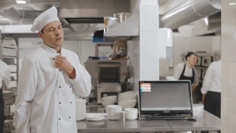 Tired chef cook taking break to relax at work in kitchen Stock Footage 125049809