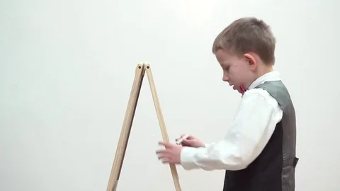 Tired child delete with hand chalk board, remove mistakes, succes Stock Footage