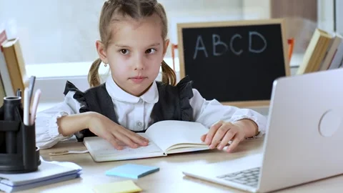 Tired child doesn't want to study. Annoyed pupil tired showing caprice emotio Stock Footage 274292817