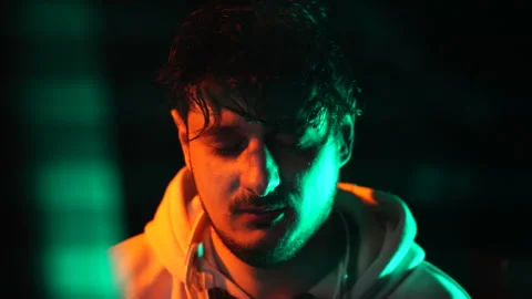 Tired Computer Programmer in Front of Glitching Screen in Dark Room, Close Up Stock Footage 297846209