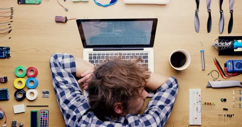 Tired, computer worker and software technician rest on a laptop from coding and Stock-Footage 223153002