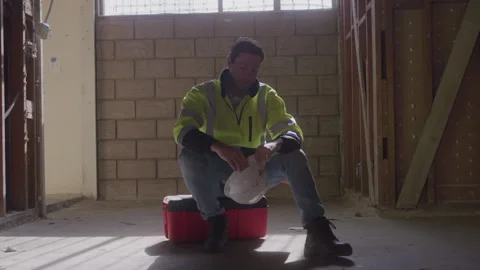 Tired Construction Man Sits On Toolbox At Work Stock Footage 270391535