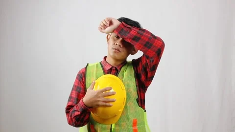 Tired construction worker holding a helmet Stock Footage 319967942