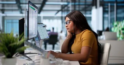 Tired Contract Manager Struggles With Complex Agreements On Laptop Screen. Stockfoto's