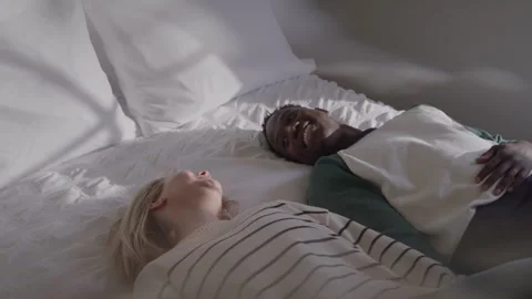 Tired Couple Falls Back On Bed Stock Footage 270295361