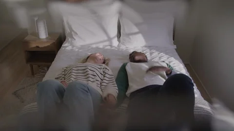 Tired Couple Falls Back On Bed High Five Stock Footage 270295452