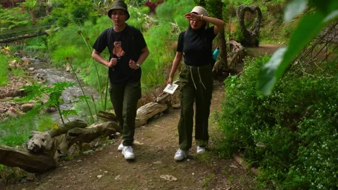 Tired Couple Taking a Break While Hiking on Nature Trail Stock Footage 270486134