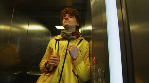 Tired courier in the elevator Stock Footage 236902974