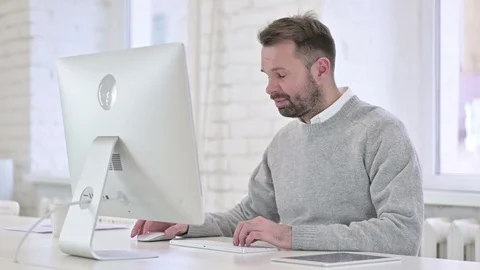 Tired Creative Man Sleeping while Working on Computer Stock Footage 121425472