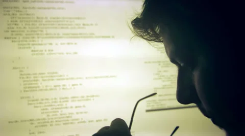 Tired developer in front of computer screen Stock Footage 35116179