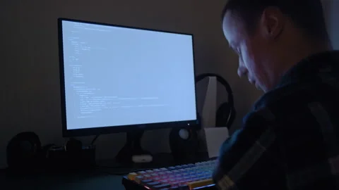 Tired Disabled Programmer Rubbing Eyes While Working on Code at Night 库存影片 321937204