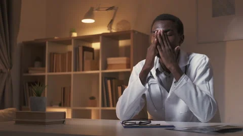 Tired doctor overwork fatigue working late shift Stock Footage 232618656