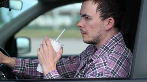 Tired driver drinks a refreshing drink after a hard day at work Vídeo Stock 208960172