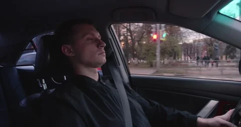 A tired driver drives a car Stock Footage